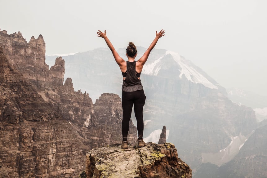 Woman Standing on Mountain